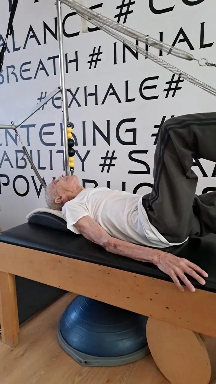 Senior Pilates: an exercise on the spine corrector