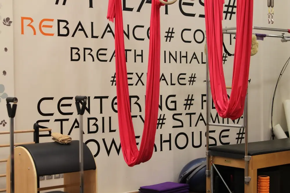 The studio wall with the silks and equipment
