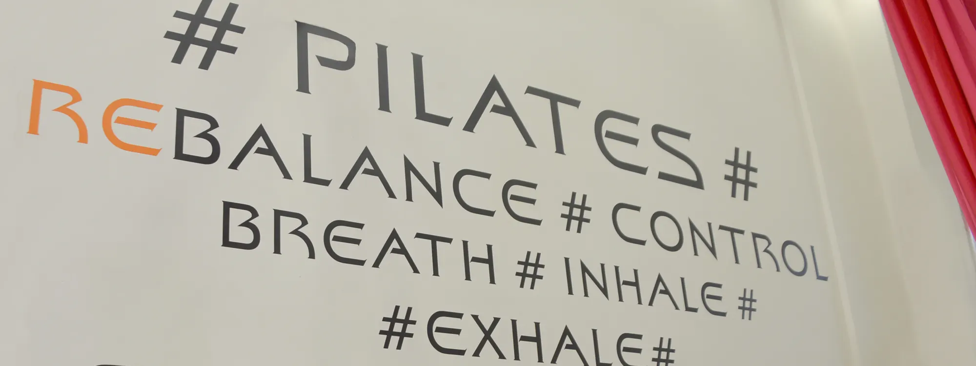 The studio wall: # PILATES # REBALANCE # CONTROL # BREATH